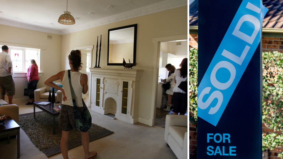 People inspect a property that is open for inspection in Bondi, Australia. A sold sign out the front of a property.