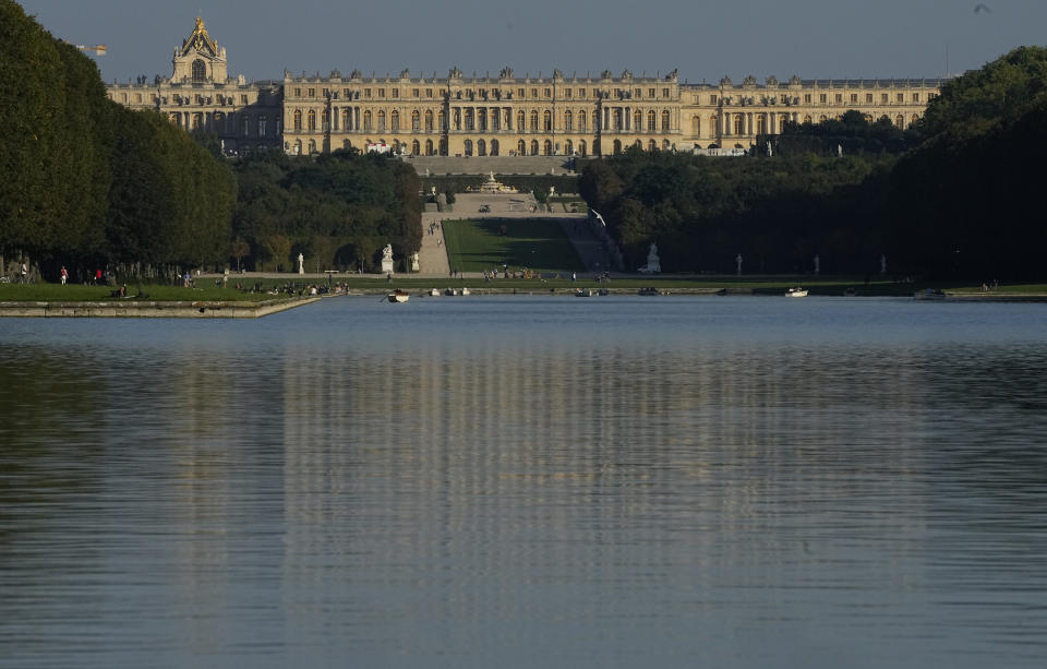 FILE - The Versailles castel is pictured by the setting sun with the Grand Canal in the foreground in Versailles, on Sept. 23, 2021. France is rolling out the red carpet for King Charles III's state visit starting on Wednesday Sept. 20, 2023 at one of its most magnificent and emblematic monuments: the Palace of Versailles, which celebrates its 400th anniversary. (AP Photo/Michel Euler, File)