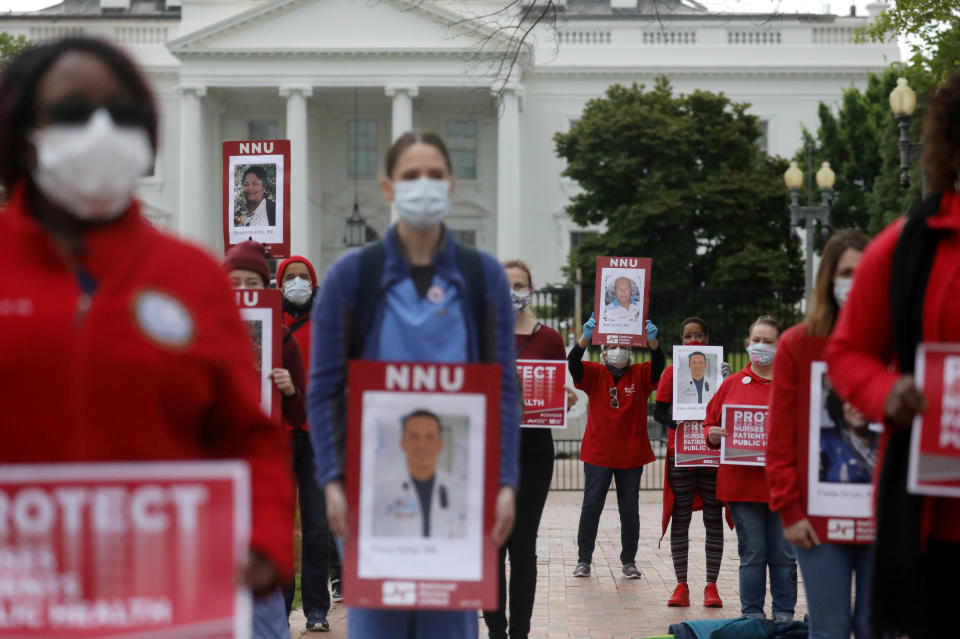 Registered Nurses and members of National Nurses United (NNU), the largest U.S. nurses union, rally on behalf of health care workers nationwide who have become infected with the coronavirus disease (COVID-19) and call on the Trump administration to order the mass production of personal protective equipment (PPE) during a protest outside of the White House in Washington, U.S., April 21, 2020. REUTERS/Leah Millis     TPX IMAGES OF THE DAY