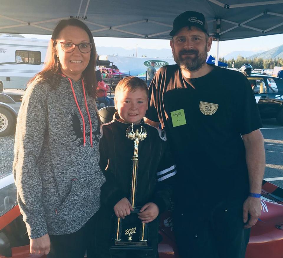 Wyatt Flowers (center) with his father John (right) and mother Amy (left). (Photo: John Flowers)