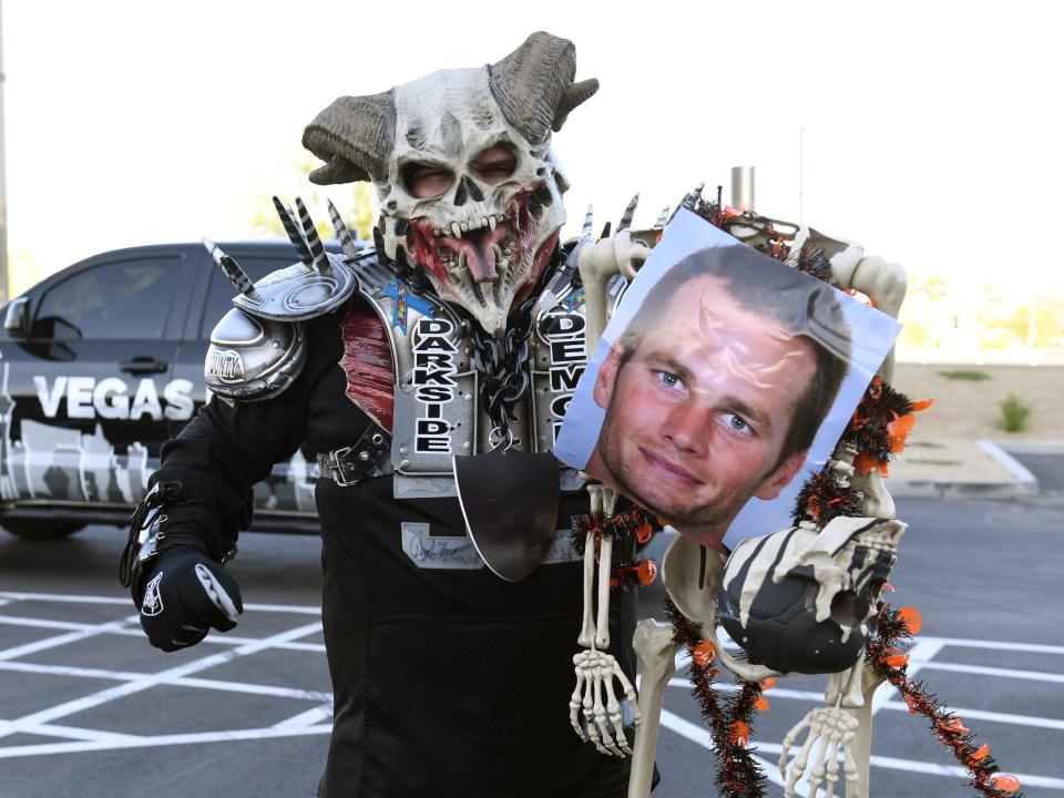 Las Vegas Raiders fan with Tom Brady skeleton.