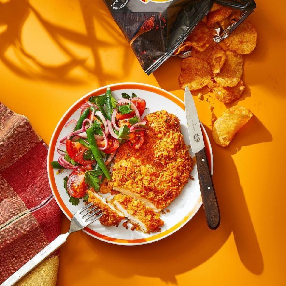 <p>Dinner and a snack in one! BBQ-flavored chips provide a crunchy and delicious crust in this recipe. </p><p>Get the <strong><a href="https://www.goodhousekeeping.com/food-recipes/a39751145/bbq-chip-chicken-recipe/" rel="nofollow noopener" target="_blank" data-ylk="slk:BBQ Chip Chicken recipe;elm:context_link;itc:0;sec:content-canvas" class="link ">BBQ Chip Chicken recipe</a></strong>. <br></p>