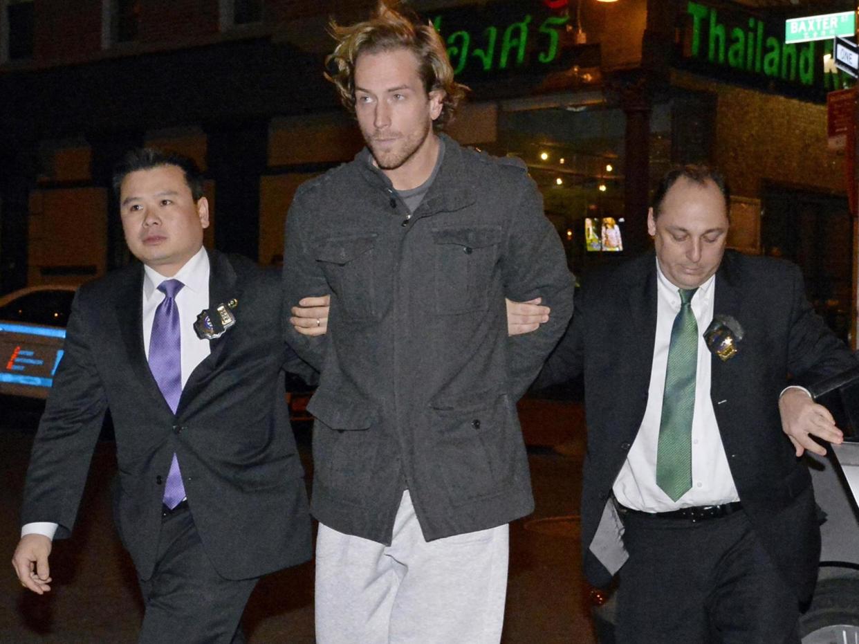 Thomas Gilbert Jr is walked into Central Booking at Manhattan Criminal Court. Gilbert is charged with murdering his father, hedge fund owner Thomas Gilbert Sr: (Jefferson Siegel/NY Daily News via Getty Images)