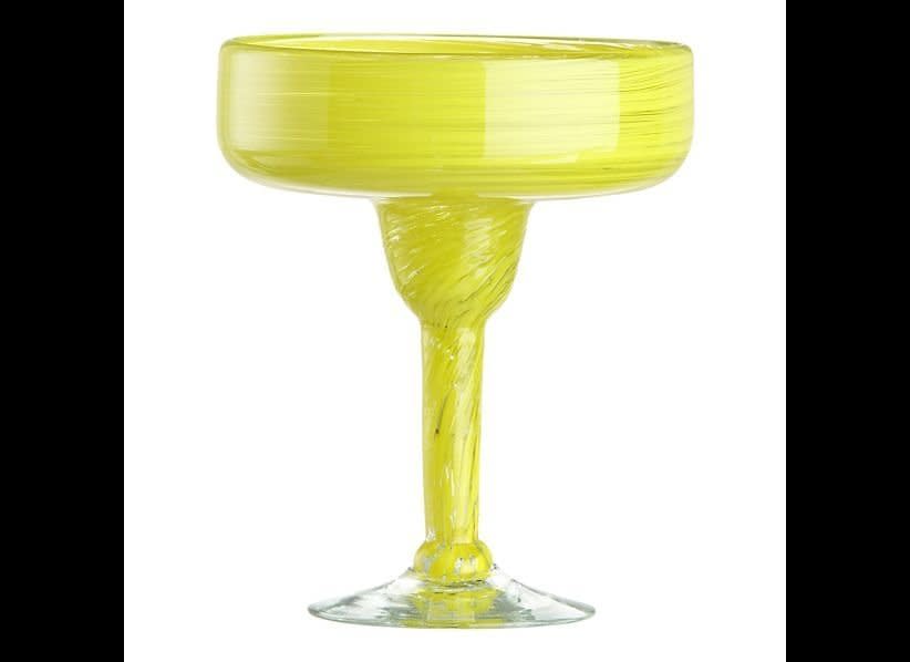 An <a href="http://www.crateandbarrel.com/dining-and-entertaining/margarita-glasses/zest-margarita-glass/s530754" target="_hplink">ordinary margarita glass</a> feels extra festive in a bright, citrusy yellow.