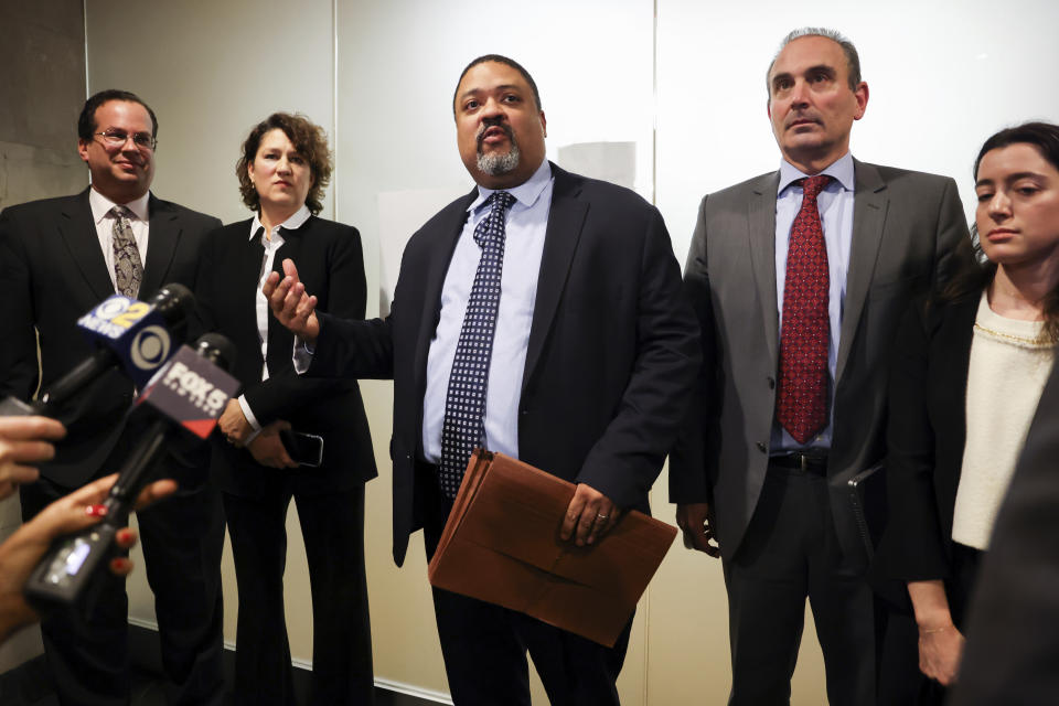 Manhattan District Attorney Alvin Bragg, center, surrounded by his legal team, speaks to the media after the jury found the Trump Organization guilty on all counts in a criminal tax fraud case, Tuesday, Dec. 6, 2022, in New York. (AP Photo/Julia Nikhinson)