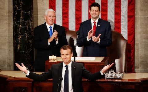 Mike Pence and Paul Ryan watch French President Emmanuel Macron address Congress - Credit: AP