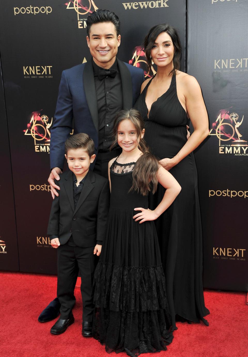 Mario Lopez,with his wife, Courtney Laine Mazza, and two of their children, Dominic and Gia, arrive at the Daytime Emmy Awards on May 5, 2019, in Pasadena, Calif.