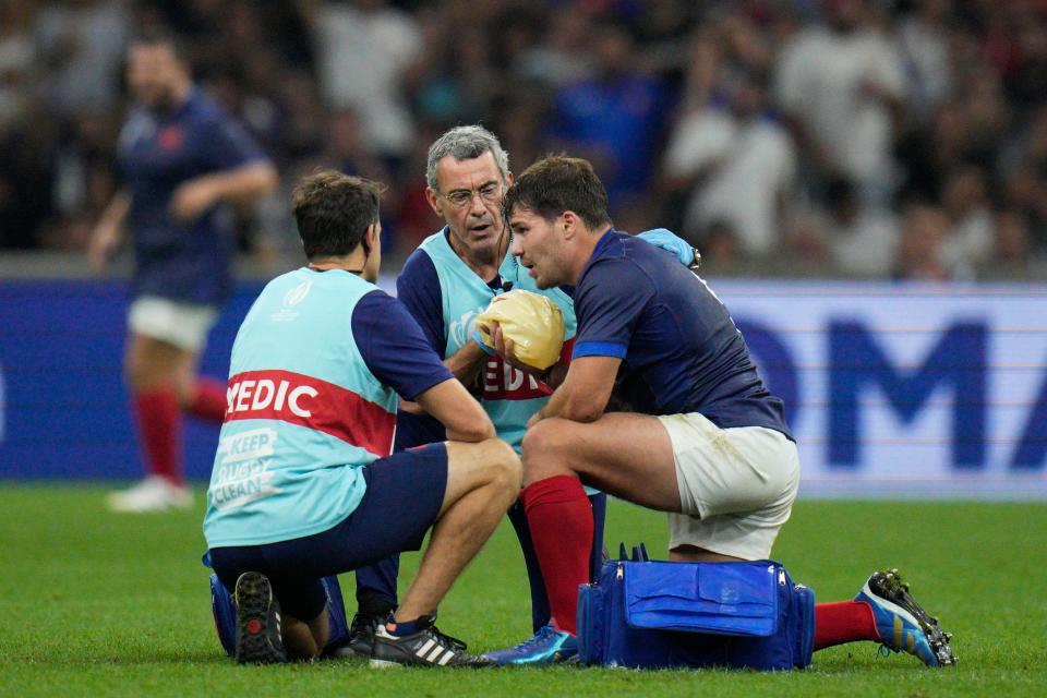 Antoine Dupont receives treatment during France’s game against Namibia (Daniel Cole/AP) (AP)