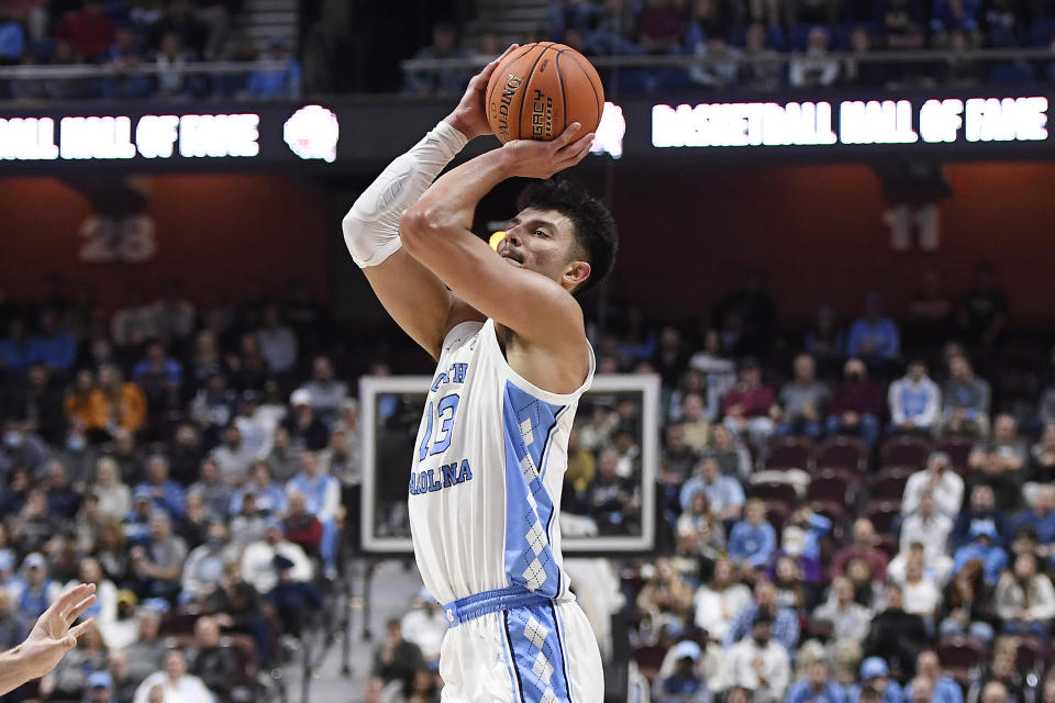 North Carolina's Dawson Garcia (13) makes a 3-point basket in the first half of an NCAA college basketball game against Purdue, Saturday, Nov. 20, 2021, in Uncasville, Conn. (AP Photo/Jessica Hill)