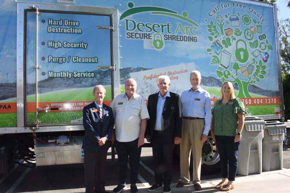 Ted Weil, Rancho Mirage city council member; Charles Townsend, mayor of Rancho Mirage; Richard Balocco, president and CEO of Desert Arc; Steve Downs, Rancho Mirage city council member, and Angelique Ontiveros, director of business services, pose in front of Desert Arc's shredding truck.