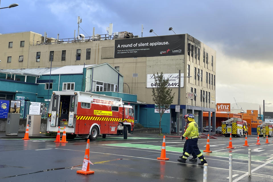 Firefighters work near a hostel in central Wellington, New Zealand, Tuesday, May 16, 2023. Several people were killed after a fire broke out overnight at the four-story building. (Ben McKay/AAP Image via AP)