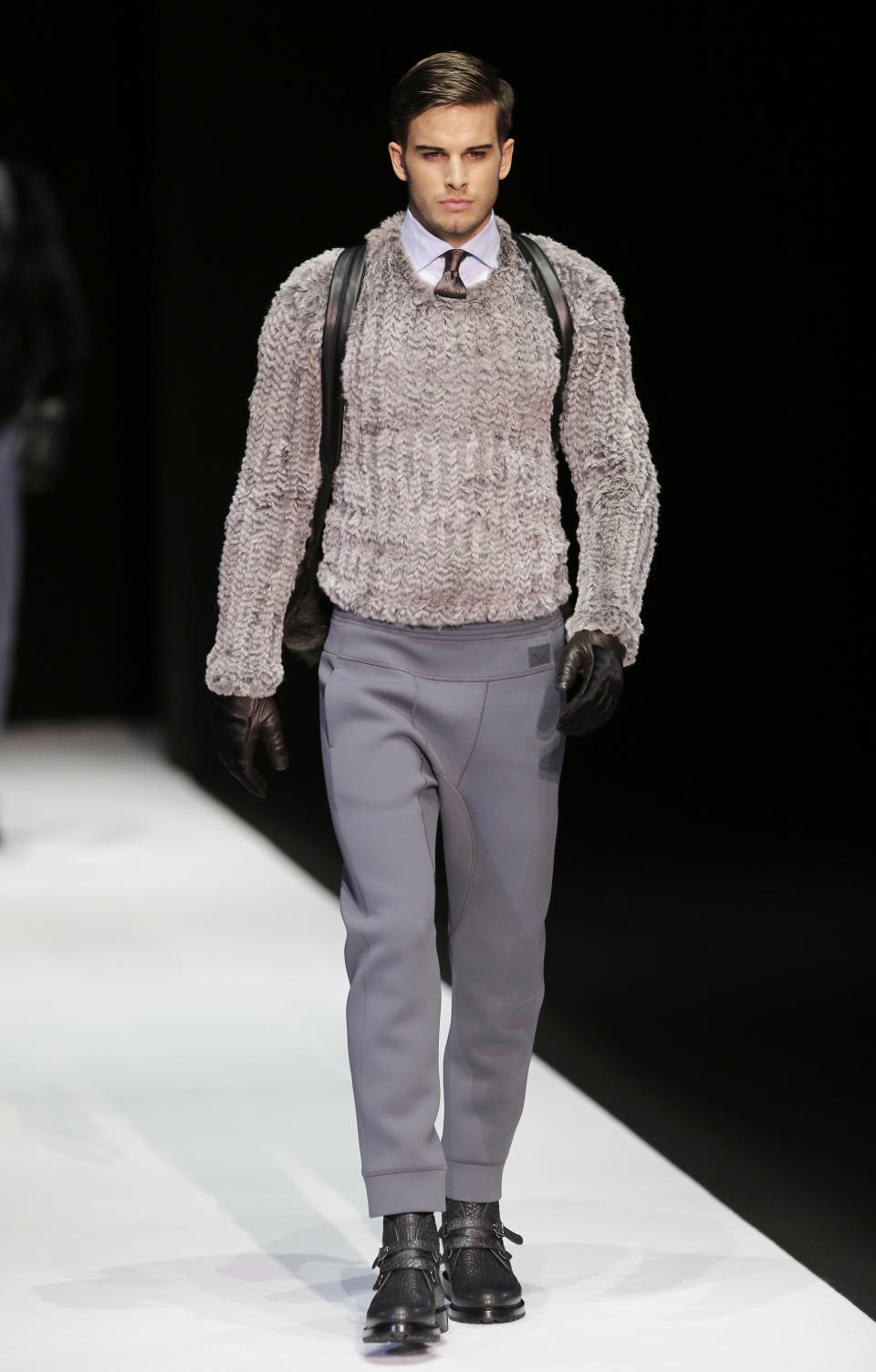 A model wears a creation for Emporio Armani men's Fall-Winter 2013-14 collection, part of the Milan Fashion Week, unveiled in Milan, Italy, Monday, Jan. 14, 2013. (AP Photo/Antonio Calanni)