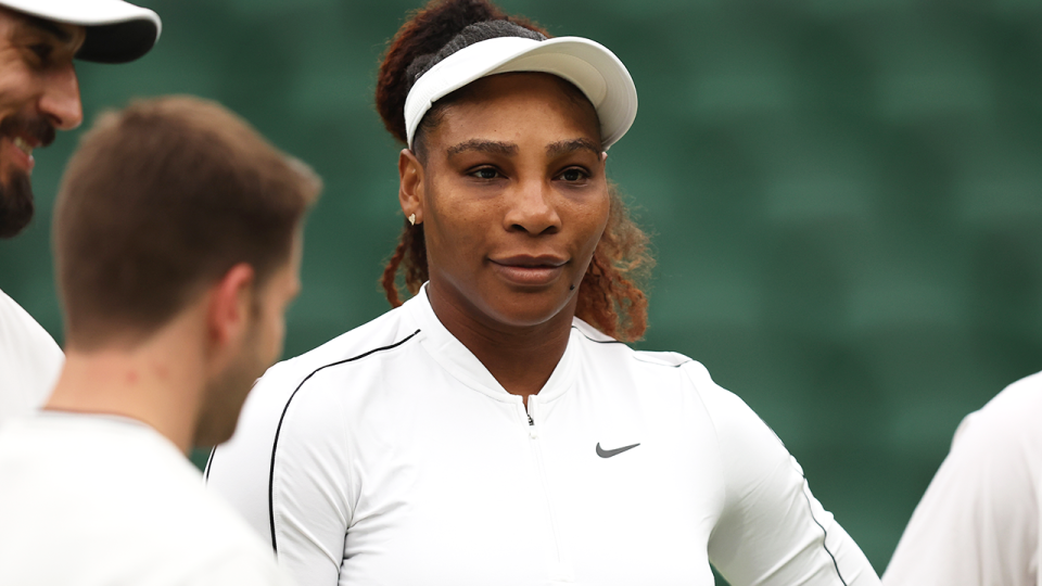 Serena Williams (pictured) speaking to her coaches ahead of Wimbledon.