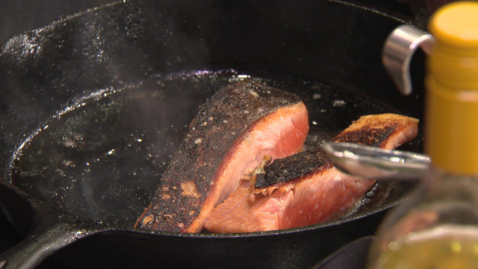 Chef Rachelle Boucher prepares some crispy skin salmon via induction cooking. / Credit: CBS News