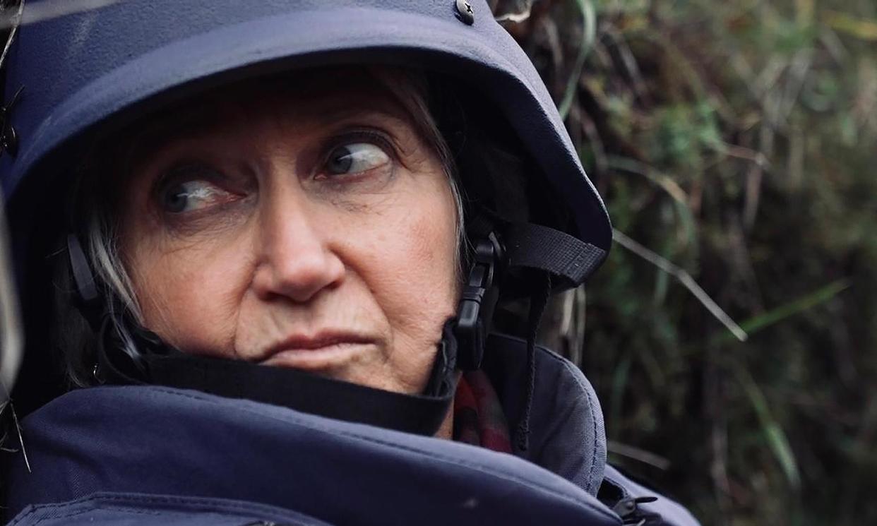 <span>Lindsey Hilsum takes cover in a trench in eastern Ukraine during Russian sniper fire in November 2022. </span><span>Photograph: Lindsey Hilsum</span>