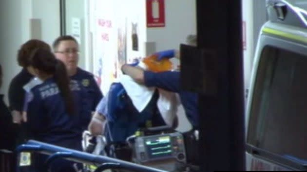 The police officer was shot in the thigh and the security guard was shot in the calf, both men are in critical condition. Photo: 7 News