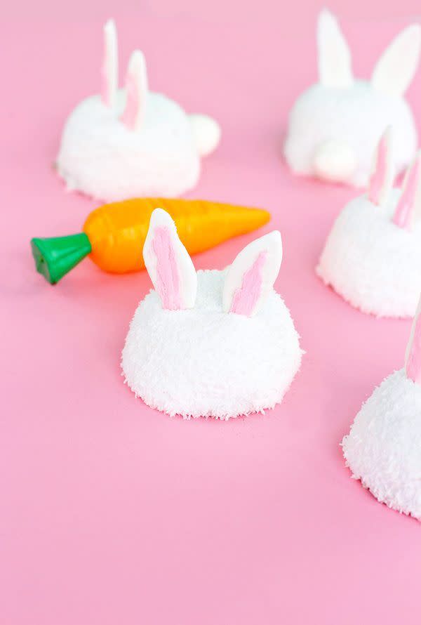 <p>Turn Hostess Sno Balls into cute little bunny rabbits with the help of some candy melts and buttercream frosting. </p><p>Get the <strong><a href="https://studiodiy.com/easter-bunny-sno-balls/" rel="nofollow noopener" target="_blank" data-ylk="slk:Easter Bunny Sno Balls recipe at Studio DIY.;elm:context_link;itc:0;sec:content-canvas" class="link ">Easter Bunny Sno Balls recipe at Studio DIY. </a></strong></p>