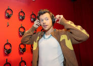 <p>Harry Styles puts on his listening ears as Spotify celebrates the release of his new album <em>Harry's House</em> on May 19 in N.Y.C.</p>