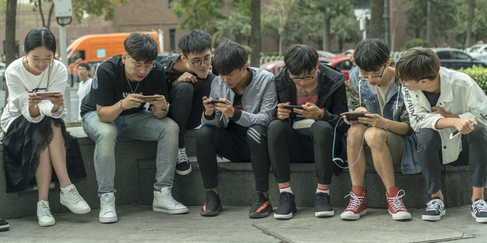 Young players practice Arena of Valor: 5v5 Arena Game, developed by Tencent Inc, outside the shopping mall on October 1, 2017 in Tianjin, China.
