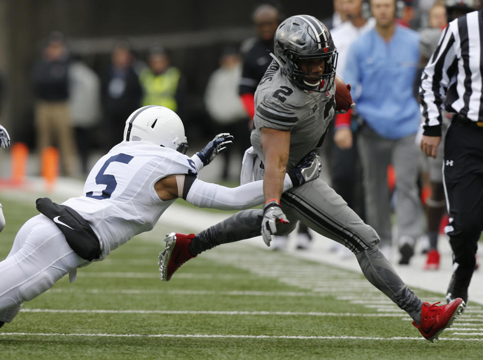 Penn State defensive back Tariq Castro-Fields, left, forces Ohio State running back J.K. Dobbins out of bounds during the first half of an NCAA college football game Saturday, Oct. 28, 2017, in Columbus, Ohio. (AP Photo/Jay LaPrete)