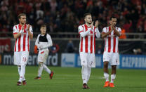 Soccer Football - Champions League - Olympiacos vs FC Barcelona - Karaiskakis Stadium, Piraeus, Greece - October 31, 2017 Olympiacos' Guillaume Gillet, Kostas Fortounis and Alaixys Romao applaud fans after the match REUTERS/Alkis Konstantinidis