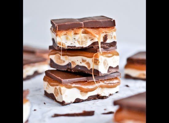 <strong>Get the <a href="http://www.howsweeteats.com/2012/01/homemade-snickers-bars/" target="_hplink">Homemade Snickers recipe from How Sweet It Is</a></strong>    The secret to making these Snickers-style bars is lots of layers. Two chocolate layers envelop a nougat layer made of evaporated milk and marshmallow fluff, a layer of salted peanuts, and a rich caramel layer.