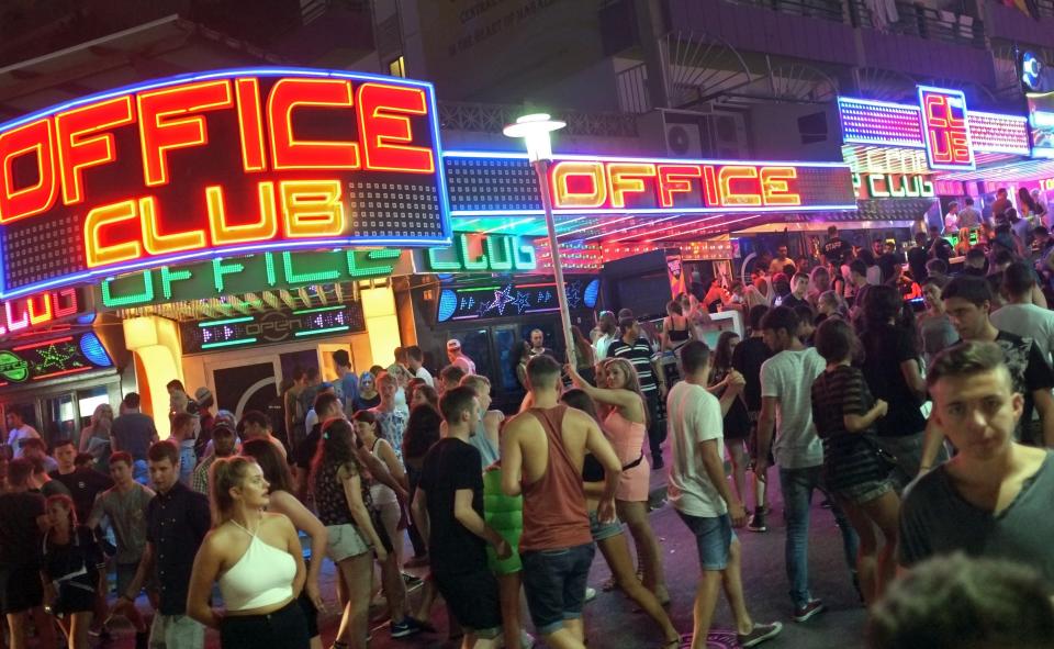 Tourists crowd in Punta Ballena street in Magaluf holiday resort in Calvia on the Spanish Mallorca Island on July 19, 2014. Known among some tourists as Shagaluf, the resort has suffered particularly bad press over the past 12 months after a video showing a Northern Irish teenage girl performing sex acts on a group of men during a bar crawl went viral last summer. It is estimated 1 million Britons visit the region each year, bringing 800 million euros (866 million dollars)  to the local economy, but the council is desperate to improve the reputation of destination, reported British journal The Guardian. AFP PHOTO / JAIME REINA        (Photo credit should read JAIME REINA/AFP/Getty Images)