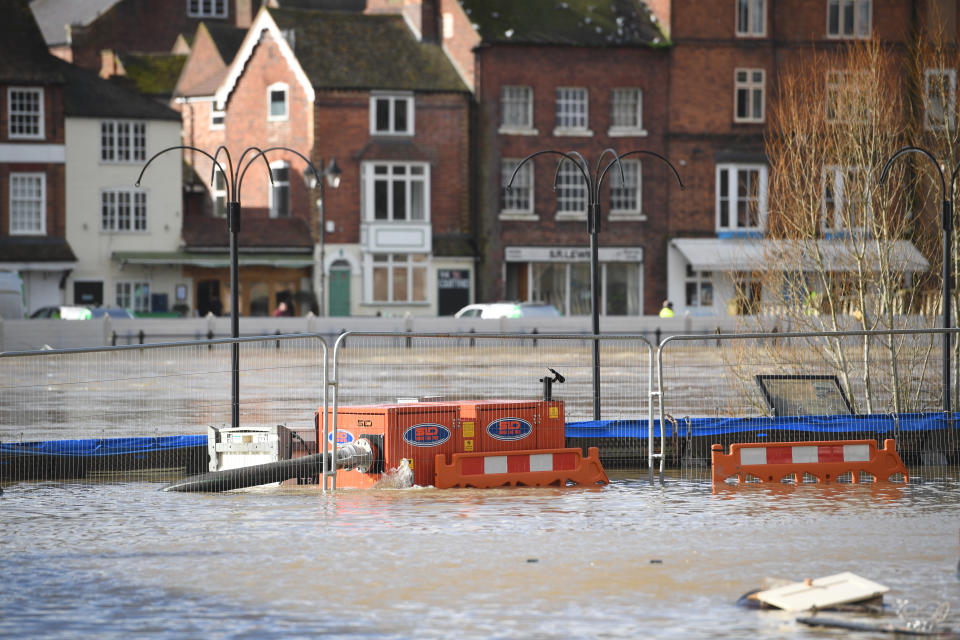 High volume water pumps installed to deal with the rising water in Bewdley, Worcestershire, sit submerged in flood water, after temporary flood defences were breached overnight as the River Severn remains high, with warnings of further flooding across the UK.