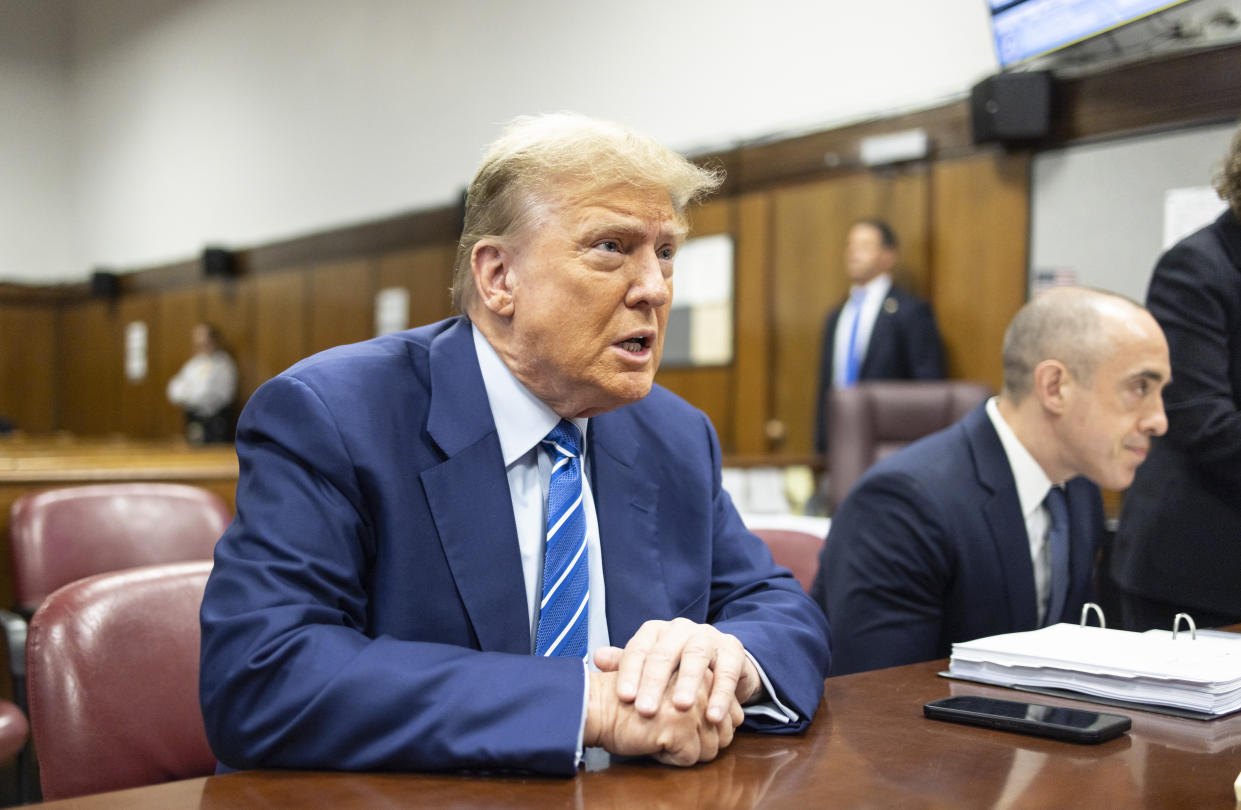 Former President Donald Trump awaits the start of proceedings on the second day of jury selection at Manhattan criminal court, Tuesday, April 16, 2024, in New York. Donald Trump returned to the courtroom Tuesday as a judge works to find a panel of jurors who will decide whether the former president is guilty of criminal charges alleging he falsified business records to cover up a sex scandal during the 2016 campaign. (Justin Lane/Pool Photo via AP)