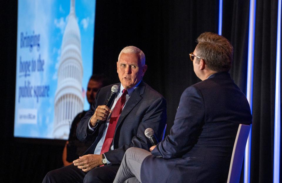 Mike Pence speaks at the Serving in the Public Square lunch during the Southern Baptist Convention, Tuesday, June 11, 2024 at the Indianapolis Marriott Downtown. Brent Leatherwood, right, lead The Ethics & Religious Liberty Commission (ERLC) event.