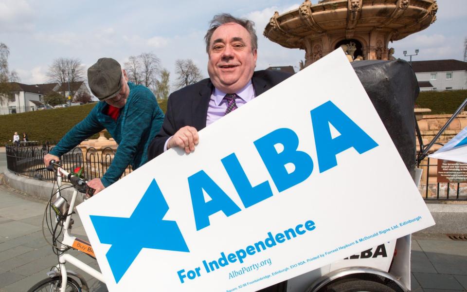 Mandatory Credit: Photo by ROBERT PERRY/EPA-EFE/Shutterstock (11865461k) Leader of the Alba Party, Alex Salmond (R) holds a placard in the back of a rickshaw during the launch of the Glasgow campaign for the Scottish Parliamentary election, in Glasgow, Britain, 19 April 2021. The former Scottish National Party (SNL) leader Alex Salmond is now leading the pro-independence Alba Party which is contesting seats in the upcoming Scottish Parliament election scheduled for 06 May. Alex Salmond leader of the Alba party campaign in Glasgow, United Kingdom - 19 Apr 2021 - ROBERT PERRY/Shutterstock