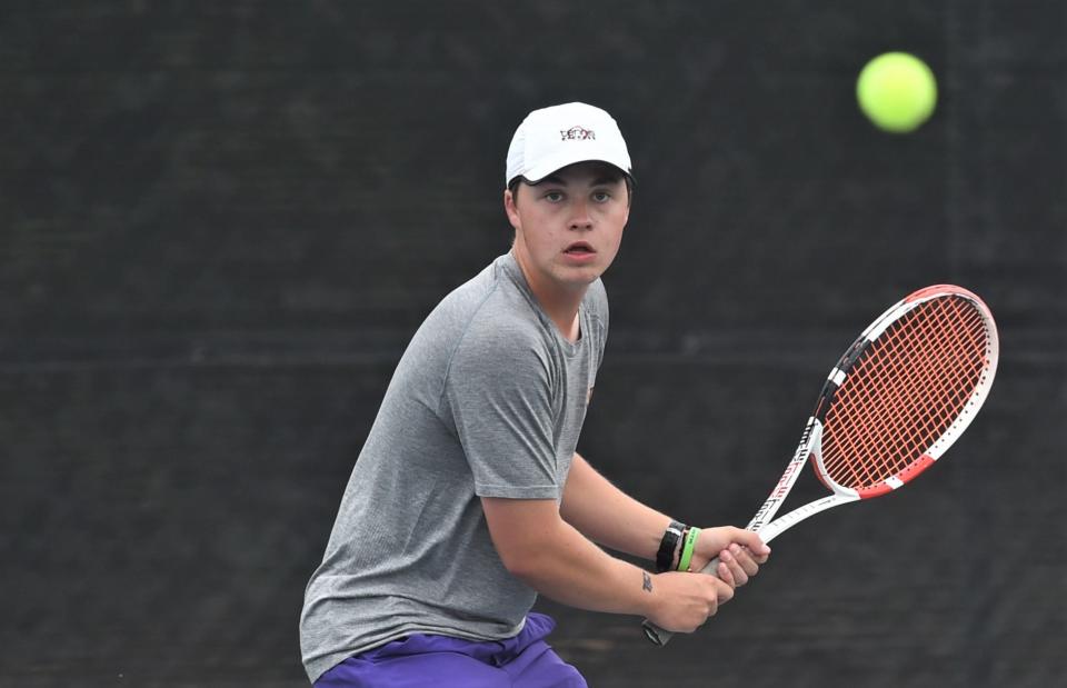 Wylie's Conner Brown runs down the ball during his boys doubles match against Austin LASA's Ted Gershon and William Gu.
