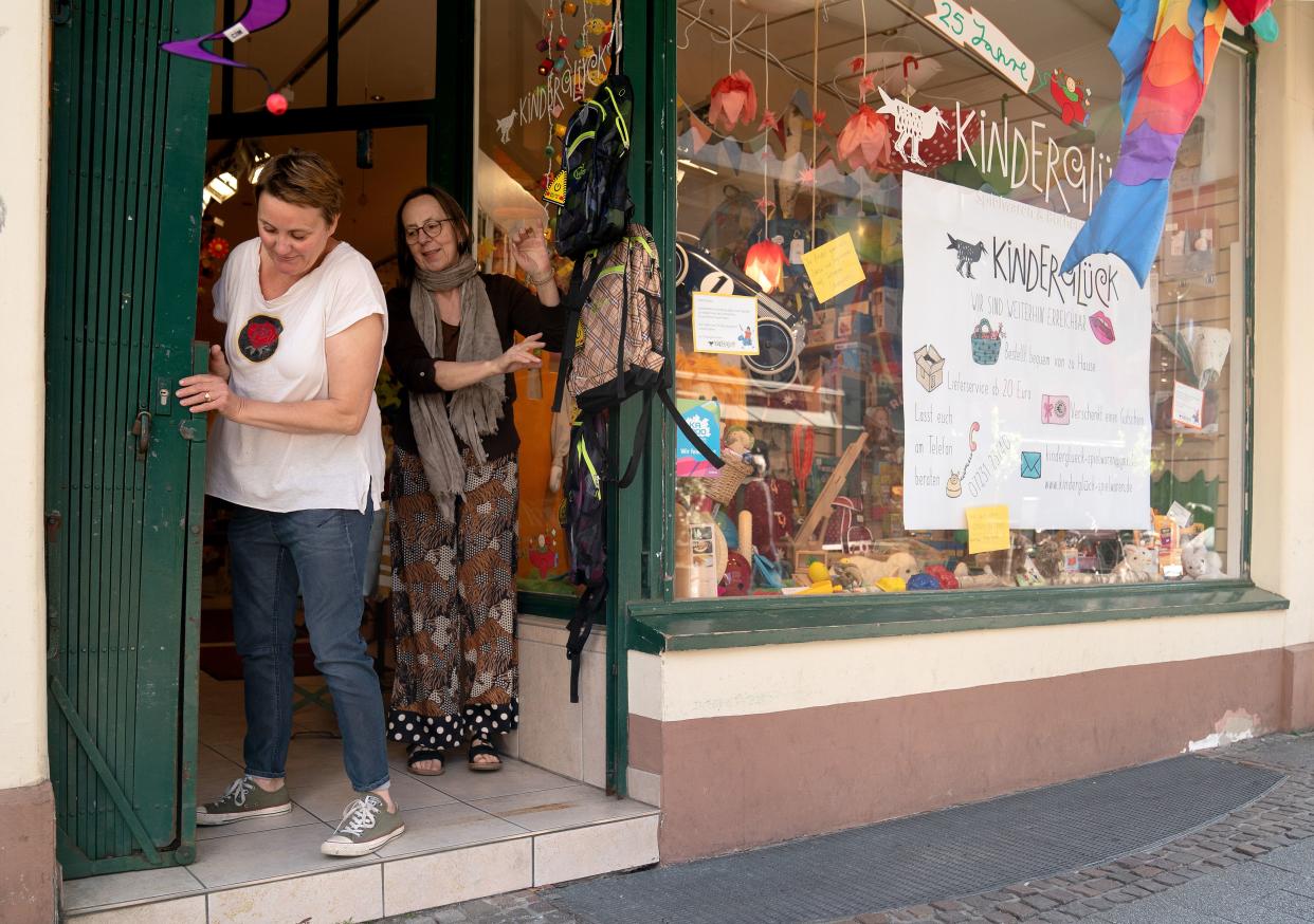 Staff of the toy store "Kinderglück" prepares for the opening of the shop on the first day of the easing of some restrictions during the coronavirus crisis on April 20, 2020, in Karlsruhe, Germany. Across Germany today many states, but not all, are introducing steps to lift restrictions that have had a deep economic and social impact, including the reopening of smaller-sized stores, allowing high school students to take exams and restarting production lines in some factories. The number of COVID-19 infections is continuing to rise, but at a slower rate than in previous weeks, which is giving the federal and state governments hope that the time is right to begin lifting restrictions.