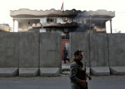 <p>Afghan policemen stand guard outside the Iraqi embassy after an attack in Kabul, Afghanistan July 31, 2017. (Mohammad Ismail/Reuters) </p>