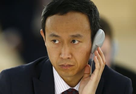 Chinese diplomat Zhang Yaojun listens during a session of the Human Rights Council at the United Nations European headquarters in Geneva March 25, 2015. REUTERS/Denis Balibouse