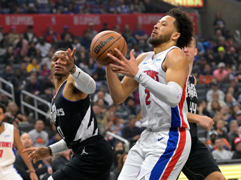 Detroit Pistons guard Cade Cunningham (2) and Los Angeles Clippers guard Russell Westbrook (0) go for a rebound in the first half at Crypto.com Arena in Los Angeles on Saturday, Feb. 10, 2024.