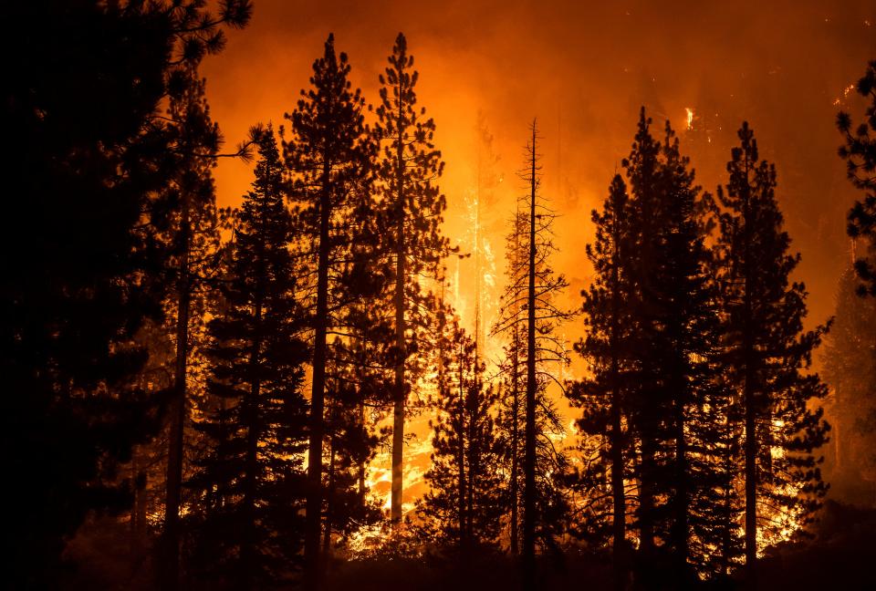 Smoke created by the Caldor Fire obscures a mountain off U.S. Highway 89 near Meyers, Calif., on Aug. 30.