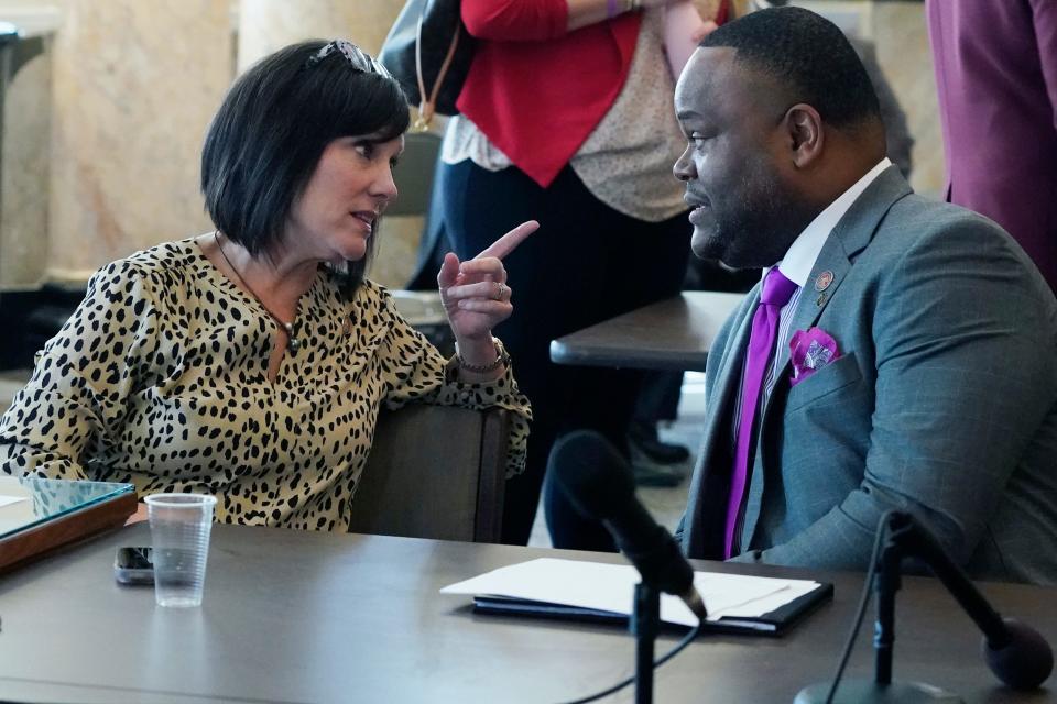 House Medicaid Committee member Missy McGee, R-Hattiesburg, left, confers with Rep. Otis Anthony, D-Indianola, Tuesday, Feb. 28, 2023 at the Mississippi State Capitol. The House passed a Medicaid bill Wednesday to expand coverage to the working poor.