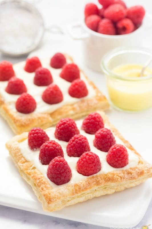 <p>Cooking On The Front Burner</p><p>The perfect dessert recipe to share with someone special! Flaky pastry, creamy lemon filling and fresh raspberries!</p><p><strong>Get the recipe: <a href="https://www.cookingonthefrontburners.com/lemon-raspberry-tarts-dessert-for-two-recipe/" rel="nofollow noopener" target="_blank" data-ylk="slk:Lemon Raspberry Tarts for Two;elm:context_link;itc:0;sec:content-canvas" class="link rapid-noclick-resp">Lemon Raspberry Tarts for Two</a></strong></p>
