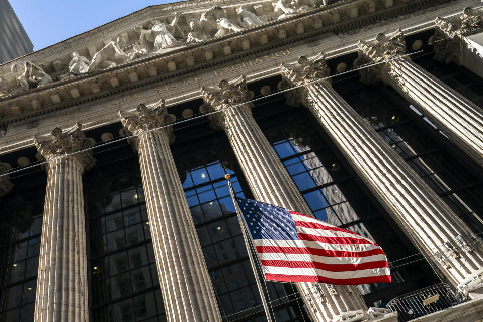 A U.S. flag waves outside the New York Stock Exchange, Monday, Jan. 24, 2022, in New York. Stocks have fallen sharply so far this year as the market readies for the Federal Reserve to raise interest rates to try to tame inflation, which is at its highest level in nearly four decades. (AP Photo/John Minchillo)