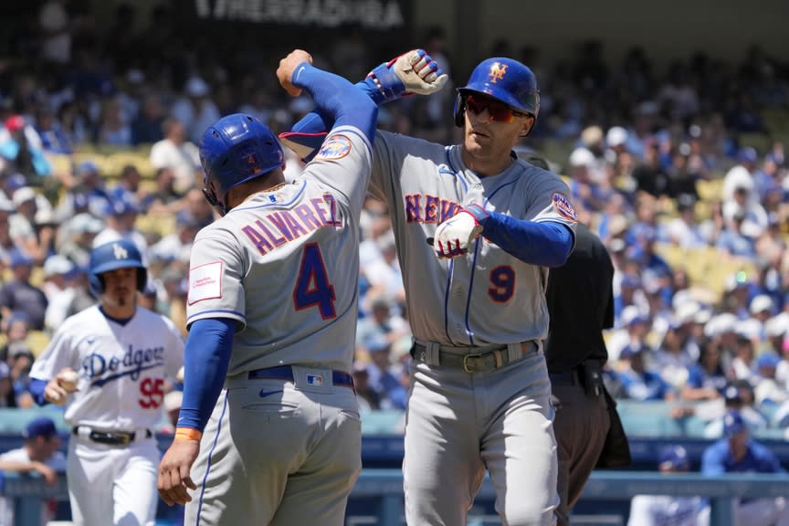 New York Mets center fielder Brandon Nimmo (9) celebrates with Mets catcher Francisco Alvarez (4) after hitting a home run in the fifth inning against the Los Angeles Dodgers at Dodger Stadium.