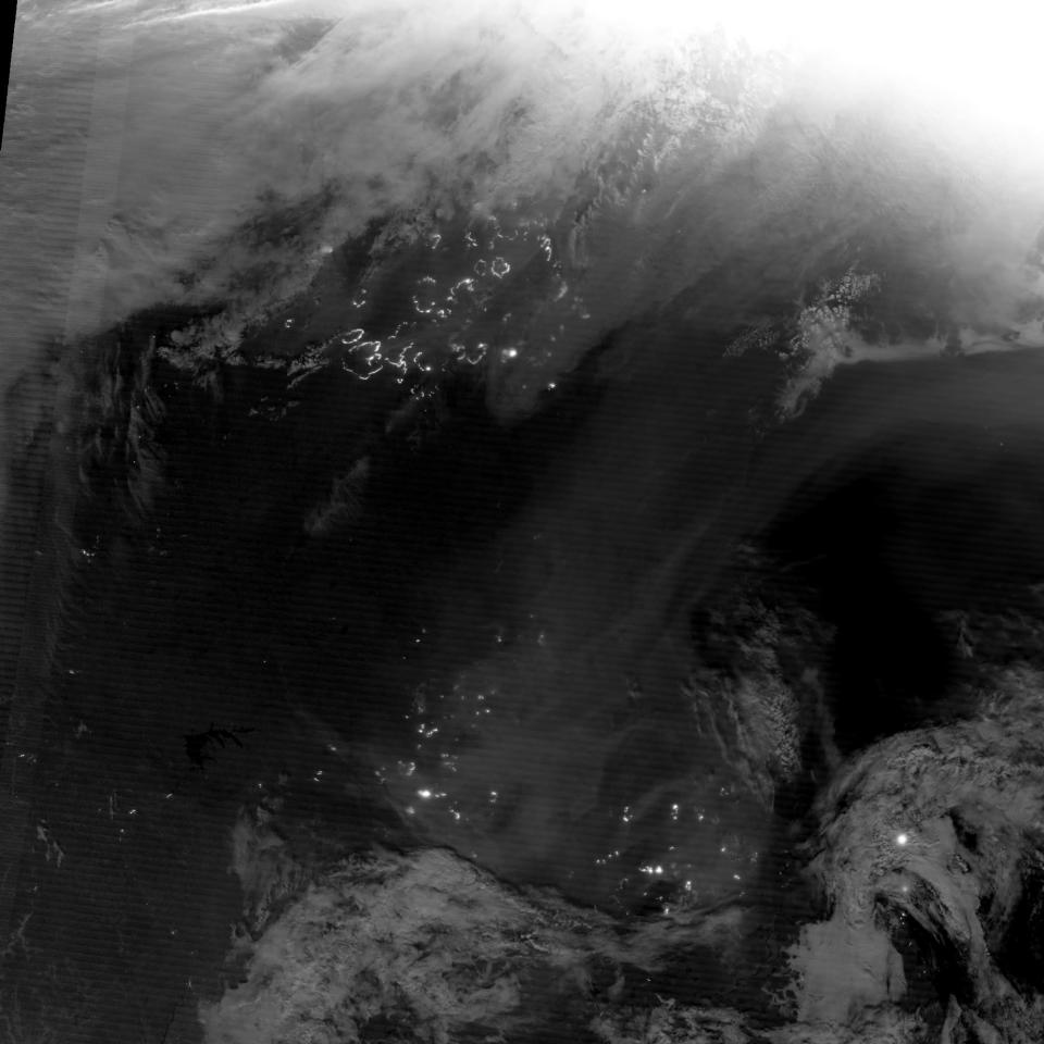 The Suomi National Polar-orbiting Partnership satellite (S-NPP) carries an instrument so sensitive to low light levels that it can detect wildfires in the middle of the night. On August 3, 2012, the Visible Infrared Imaging Radiometer Suite (VIIRS) on Suomi-NPP acquired the top image of wildfires blazing in eastern Siberia. The image is from the instrument’s “day-night band,” which sensed the fire in the visible portion of the spectrum. The brightest fires are white; smoke is light gray. (NASA)