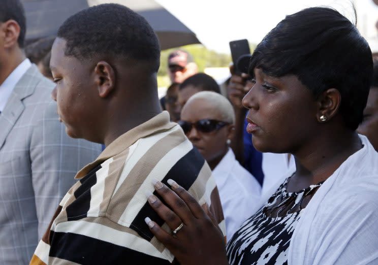 Quinyetta McMillon stands alongside her son, Cameron Sterling, as speaks to media outside the Triple S Food Mart where his father Alton Sterling was killed, in Baton Rouge, La. earlier this month. (Photo: Gerald Herbert/Associated Press) 