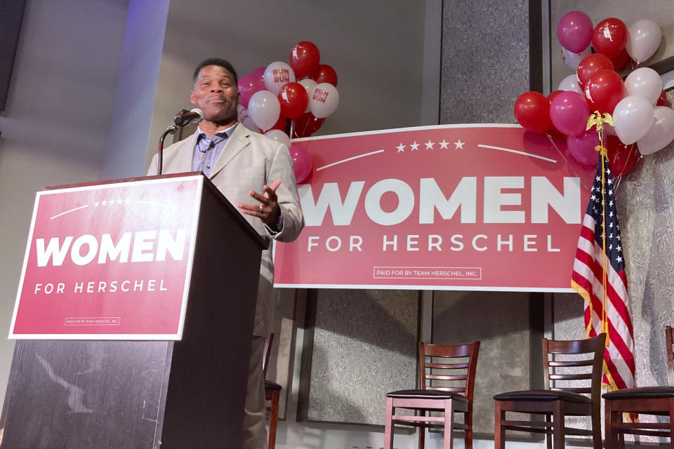 Republican U.S. Senate candidate Herschel Walker speaks to a standing-room-only crowd of supporters in suburban Atlanta, on Aug. 17, 2022. Since winning the GOP nomination, Walker has stepped up his public appearances with many themed around certain policies. But the 60-year-old political novice is often light or errant on policy details as he tries to unseat Democratic Sen. Raphael Warnock. Walker's campaign says his conservative credentials are more important than policy specifics. But Warnock and other Democrats are hammering Walker as unprepared and unfit for high office. (AP Photo/Bill Barrow)