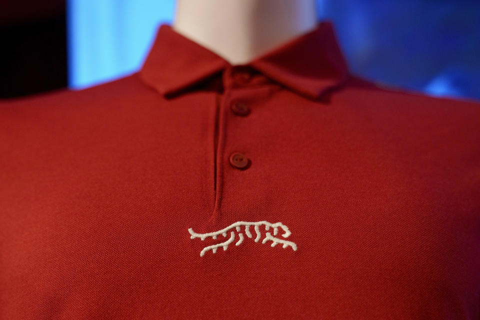 Merchandise from Tiger Woods' new clothing line, called Sun Day Red, is displayed during a news conference ahead of the Genesis Open golf tournament, Monday, Feb. 12, 2024, in the Pacific Palisades area of Los Angeles. (AP Photo/Eric Thayer)