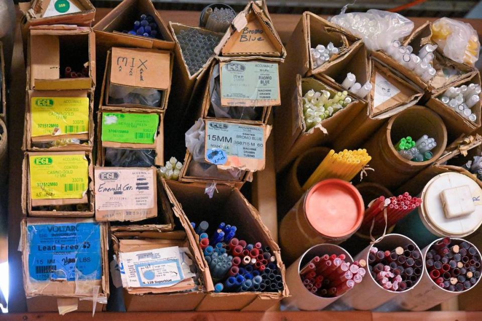 Glass tubes used to make neon signs are stored at Element Ten on Troost Avenue, a studio that has helped restore signs to be displayed at Pennway Point.