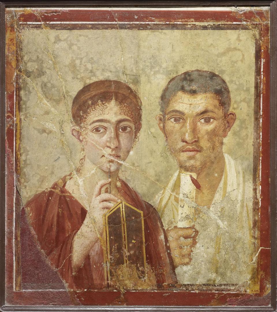 Undated handout photo issued by the British Musuem Thursday Sept. 20, 2012 of a wall painting of the baker Terentius Neo and his wife, from the House of Terentius Neo, Pompeii, AD 50-79. as dozens of objects recovered from the ruins of Roman cities Pompeii and Herculaneum will go on show outside Italy for the first time at a new exhibition at the museum. The two cities on the Bay of Naples were wiped out by the eruption of Mount Vesuvius in 79 AD. The show will feature objects found in their ruins including jewellery, carbonised food and a baby’s crib that still rocks on its curved runners. The exhibition will run March 28 to Sept. 29, 2013. (AP Photo/The Trustees of the British Museum)