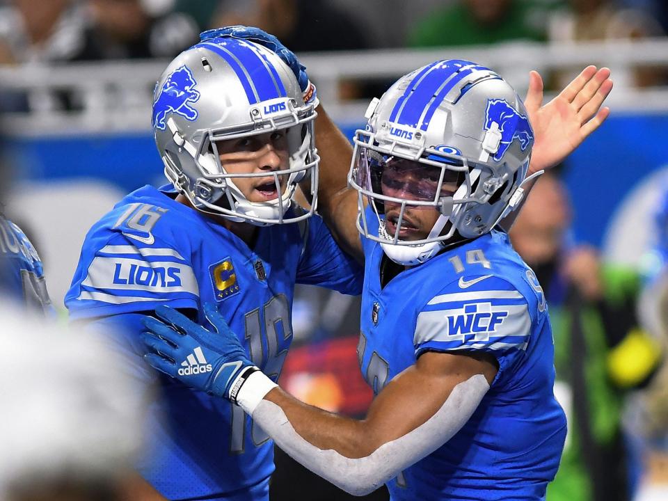 Amon-Ra St. Brown celebrates a touchdown against the Philadelphia Eagles.