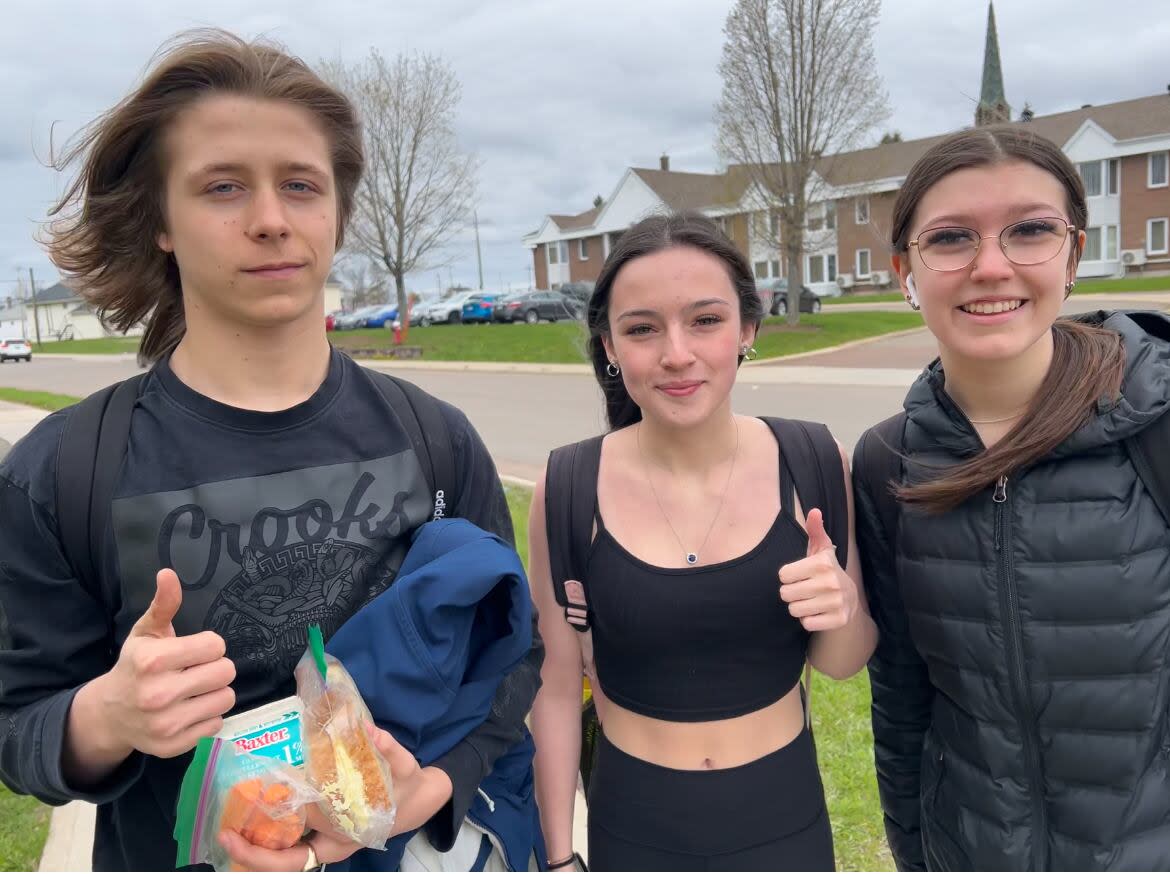 Jordan Steeves, Taija LeBlanc and Keira Boudreau say the cellphone ban is not new for them. But they are happy that every school will now be on the same page.  (Rhythm Rathi/CBC - image credit)