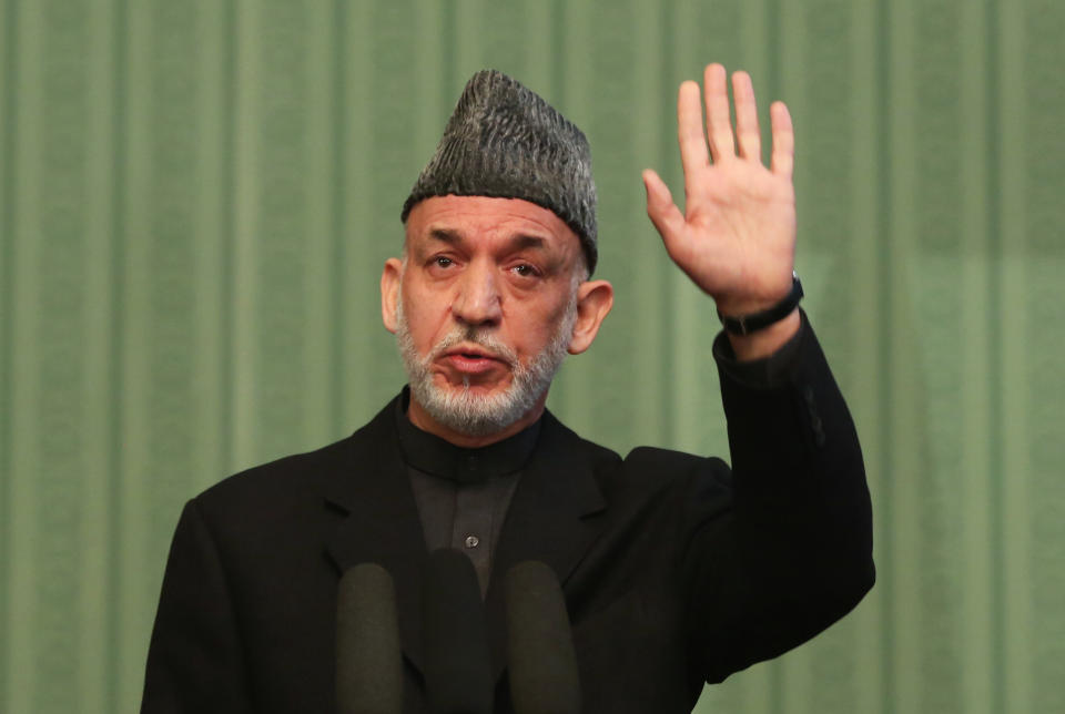 Afghan President Hamid Karzai speaks during a press conference at the presidential palace in Kabul, Afghanistan, Saturday, Jan. 25, 2014. Karzai said he will not sign a security pact with the United States unless Washington and Pakistan launch a peace process with Taliban insurgents. (AP Photo/Massoud Hossaini)